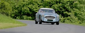 Classic Austin Healey on scenic road