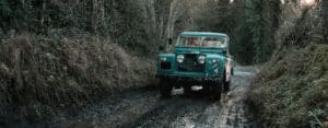 Classic Land Rover in mud trail