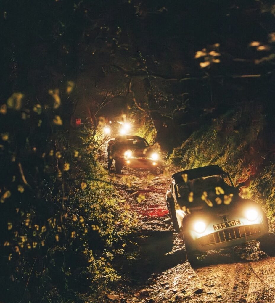 Land's End Trial Cars heading through a night section