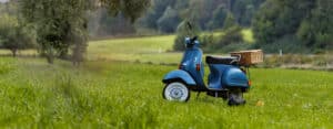 Blue Lambretta Scooter on field